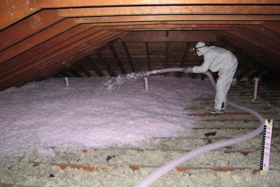 man doing blow in insulation at roof attic waterford twp mi
